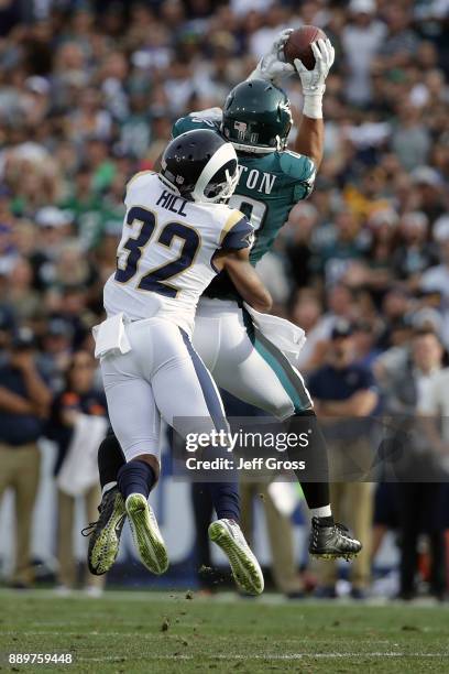 Trey Burton of the Philadelphia Eagles makes a catch over Troy Hill of the Los Angeles Rams during the second quarter of the game at the Los Angeles...