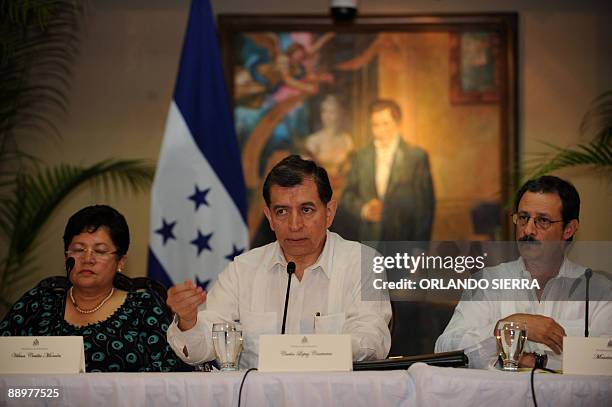 Vilma Morales , Carlos Lopez and Mauricio Villeda , members of the delegation representing interim Honduran leader Roberto Micheletti, answer...
