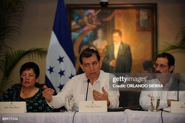 Vilma Morales , Carlos Lopez and Mauricio Villeda , members of the delegation representing interim Honduran leader Roberto Micheletti, answer...