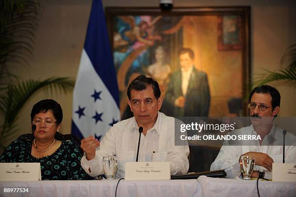 Vilma Morales , Carlos Lopez and Mauricio Villeda , members of the delegation representing interim Honduran leader Roberto Micheletti, answer...