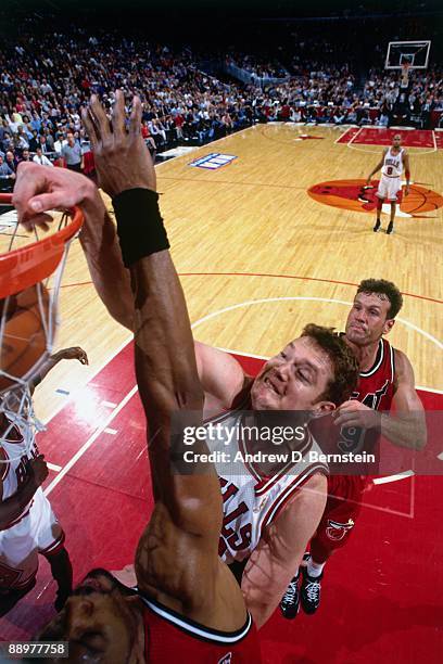 Luc Longley of the Chicago Bulls dunks against the Miami Heat in Game Five of the Eastern Conference Finals during the 1997 NBA Playoffs at the...