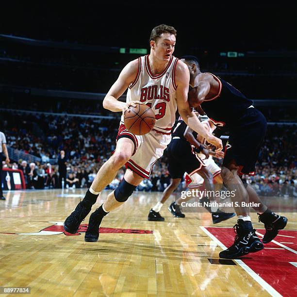 Luc Longley of the Chicago Bulls drives to the basket against the Miami Heat in Game One of the Eastern Conference Quarterfinals during the 1996 NBA...