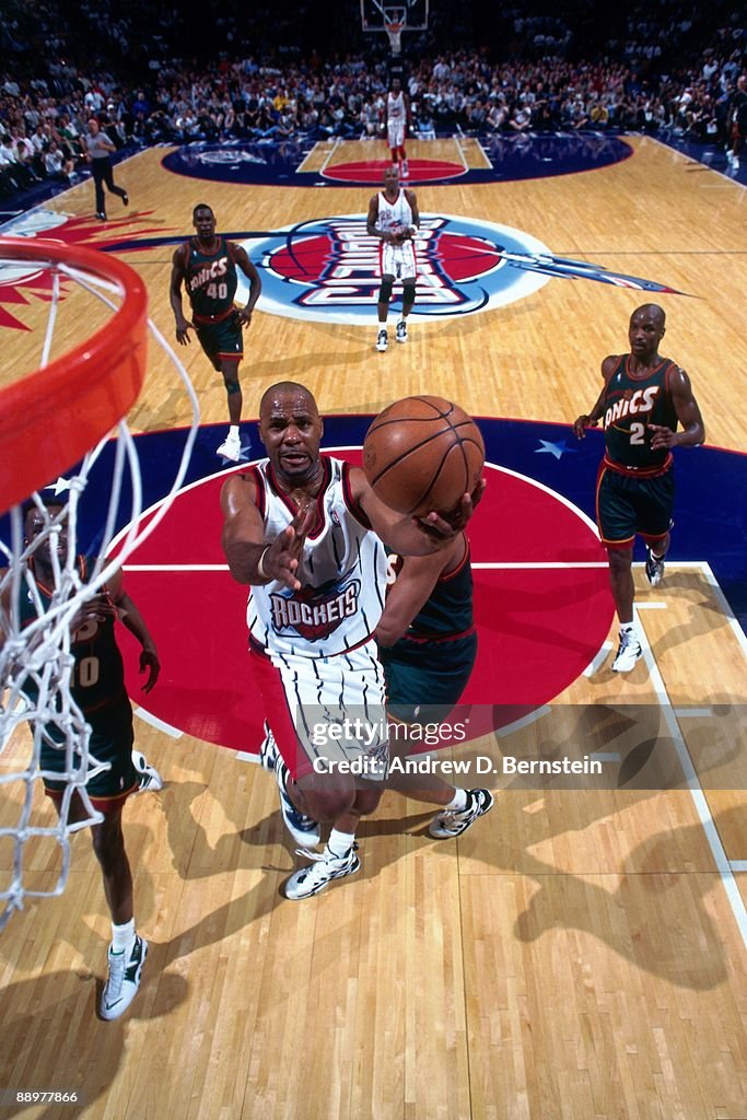Mario Elie of the Houston Rockets shoots a layup against the Seattle ...