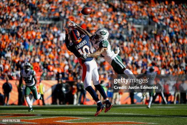 Cornerback Buster Skrine of the New York Jets defends a pass away from wide receiver Emmanuel Sanders of the Denver Broncos during the first quarter...