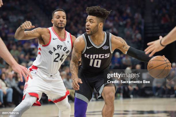 Sacramento Kings guard Frank Mason III looks to make a pass against Toronto Raptors forward Norman Powell on Sunday, Dec. 10, 2017 at the Golden 1...