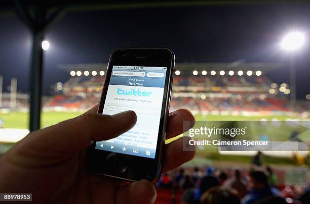 In this photo illustration the Twitter website is displayed on a mobile phone at a NRL match on July 11, 2009 in Newcastle, Australia. The...