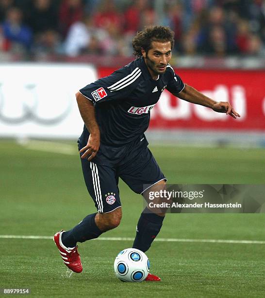 Hamit Altintop of Muenchen runs with the ball during the pre-season friendly match between Red Bull Salzburg and FC Bayern Muenchen at the Red Bull...