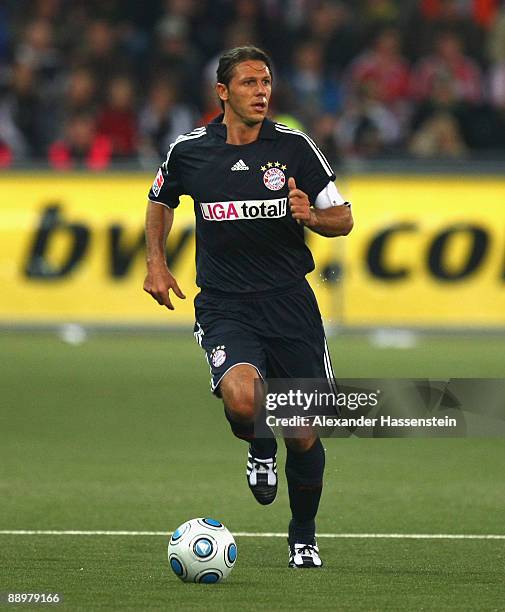 Martin Demichelis of Muenchen runs with the ball during the pre-season friendly match between Red Bull Salzburg and FC Bayern Muenchen at the Red...