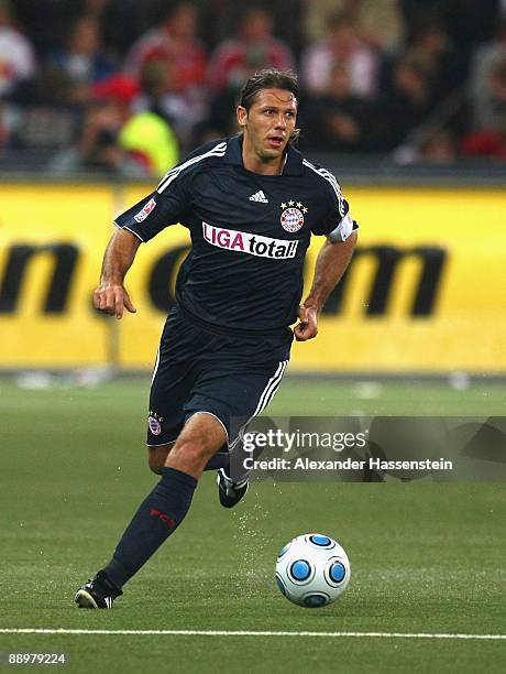 Martin Demichelis of Muenchen runs with the ball during the pre-season friendly match between Red Bull Salzburg and FC Bayern Muenchen at the Red...