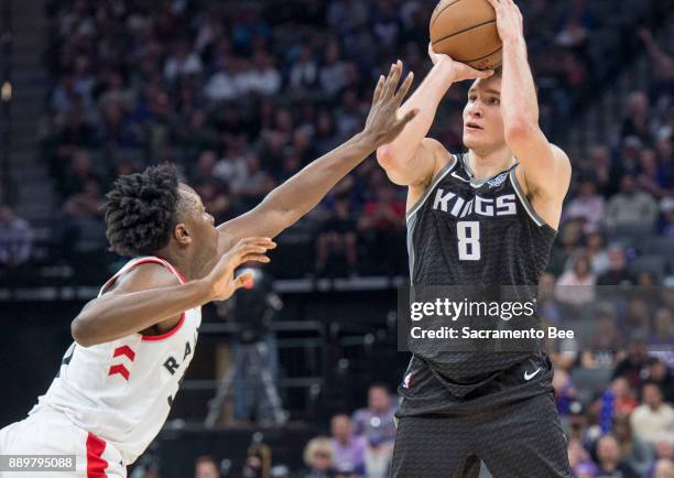 Sacramento Kings guard Bogdan Bogdanovic shoots a three-point basket against the Toronto Raptors on Sunday, Dec. 10, 2017 at the Golden 1 Center in...