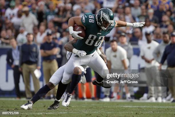 Troy Hill of the Los Angeles Rams tackles Trey Burton of the Philadelphia Eagles during the second quarter of the game at the Los Angeles Memorial...