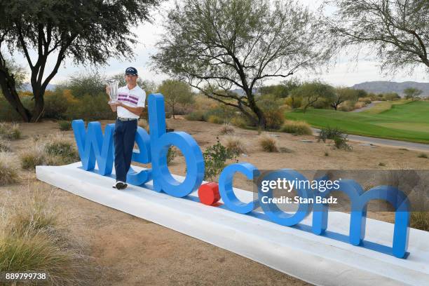 Lee McCoy poses with the winner's trophy after the final round of the Web.com Tour Qualifying Tournament at Whirlwind Golf Club on the Cattail course...