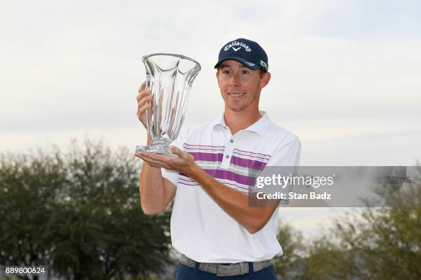 Lee McCoy poses with the winner's trophy after the final round of the Web.com Tour Qualifying Tournament at Whirlwind Golf Club on the Cattail course...