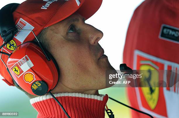 Seven times drivers champion and Ferrari team advisor Michael Schumacher is pictured in the pits of the Nurburgring racetrack on July 11, 2009 in...