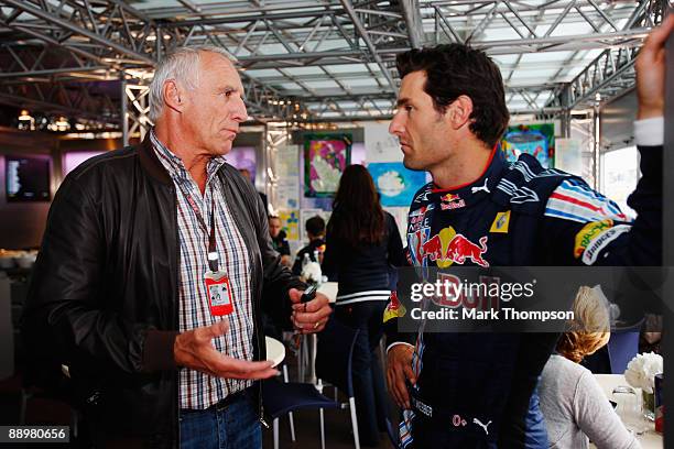 Mark Webber of Australia and Red Bull Racing talks with Red Bull owner Dietrich Mateschitz after taking pole position during qualifying for the...