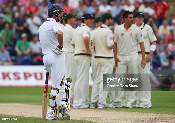 Andrew Strauss of England watches the dismissal of Alastair Cook on the big screen during day four of the npower 1st Ashes Test Match between England...