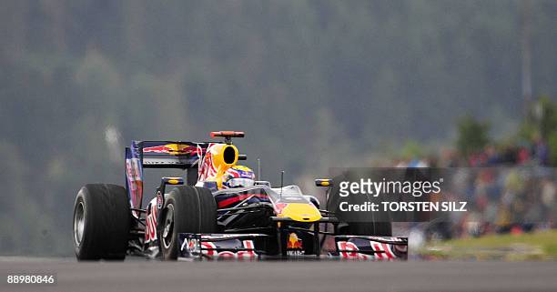 Red Bull's Australian driver Mark Webber drives at the Nurburgring racetrack on July 11, 2009 in Nurburg, western Germany, during the qualifying...