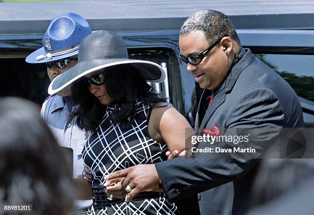 Mechelle McNair, wife of slain quarterback Steve McNair, is escorted into a funeral service for former NFL quarterback Steve McNair on July 11, 2009...