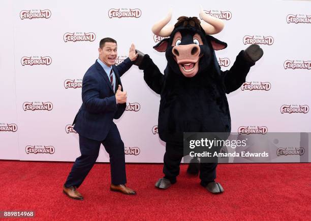 Actor and wrestler John Cena and Ferdinand arrive at a screening of 20th Century Fox's "Ferdinand" at the Zanuck Theater at 20th Century Fox Lot on...