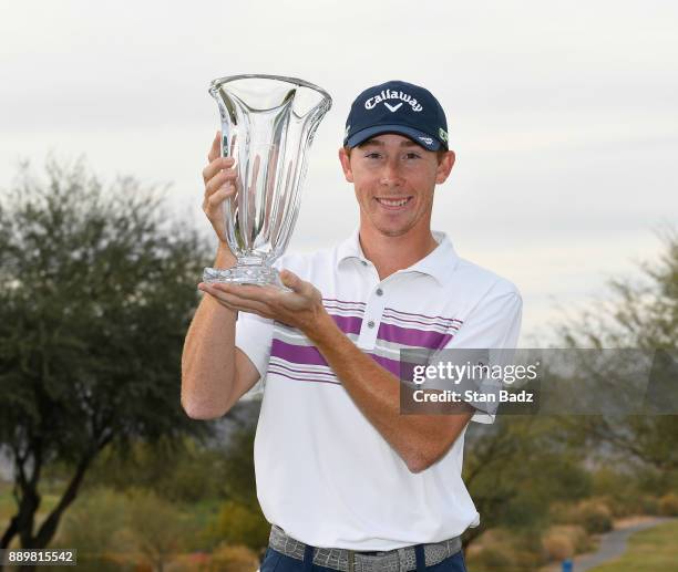 Lee McCoy poses with the winner's trophy after the final round of the Web.com Tour Qualifying Tournament at Whirlwind Golf Club on the Cattail course...