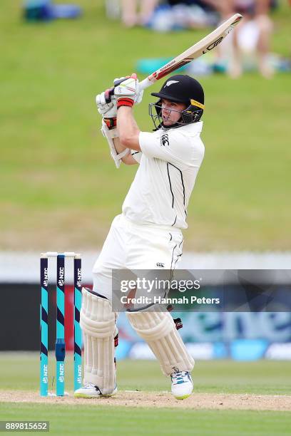 Tom Latham of New Zealand pulls the ball away for four runs during day three of the Second Test Match between New Zealand and the West Indies at...