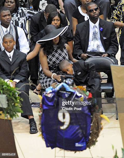 Mechelle McNair, center, and family members attend a funeral service for former NFL quarterback Steve McNair on July 11, 2009 in Hattiesburg,...