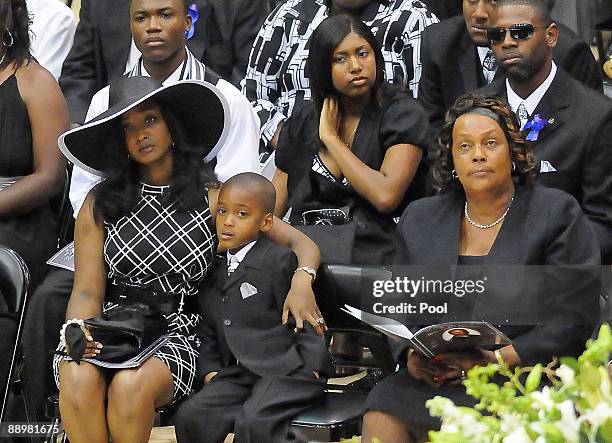 Family members attend a funeral service for former NFL quarterback Steve McNair on July 11, 2009 in Hattiesburg, Mississippi. Mechelle McNair, wife...