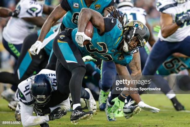 Jacksonville Jaguars running back Chris Ivory is tackled during the game between the Seattle Seahawks and the Jacksonville Jaguars on December 10,...