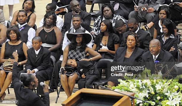 Family members attend a funeral service for former NFL quarterback Steve McNair on July 11, 2009 in Hattiesburg, Mississippi. Mechelle McNair, wife...