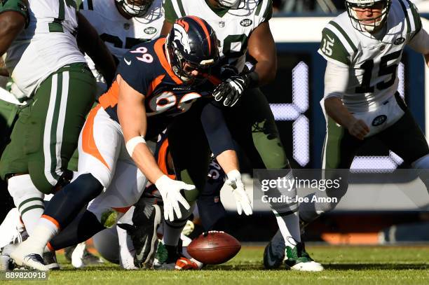 Denver Broncos defensive end Adam Gotsis recovers a fumble in the first quarter as the Broncos play the New York Jets at Sports Authority Field at...