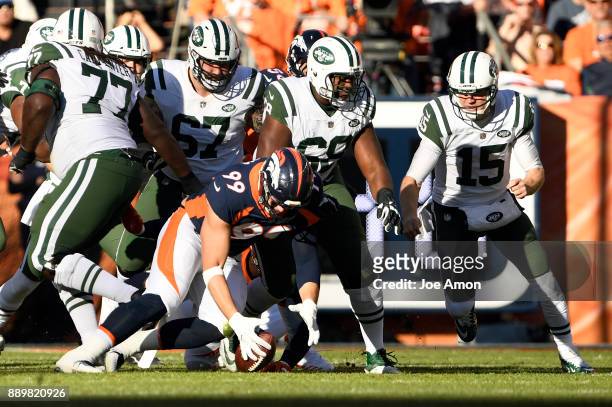 Denver Broncos defensive end Adam Gotsis recovers a fumble in the first quarter as the Broncos play the New York Jets at Sports Authority Field at...