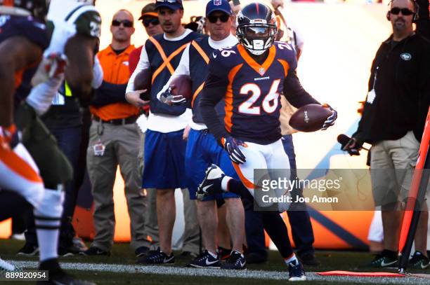 Denver Broncos free safety Darian Stewart returning his interception in the first half as the Broncos play the New York Jets at Sports Authority...