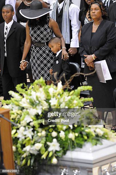 Family members react during a funeral service for former NFL quarterback Steve McNair on July 11, 2009 in Hattiesburg, Mississippi. McNair's wife...