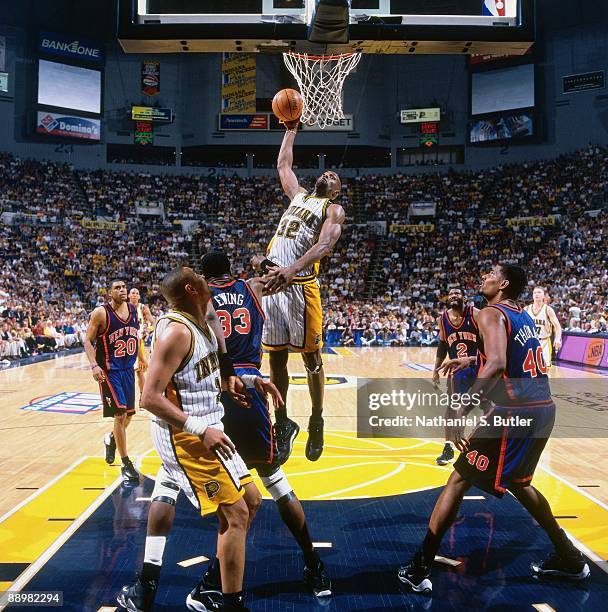 Dale Davis of the Indiana Pacers goes up for a dunk against the New York Knicks in Game One of the Eastern Conference Finals during the 1999 NBA...