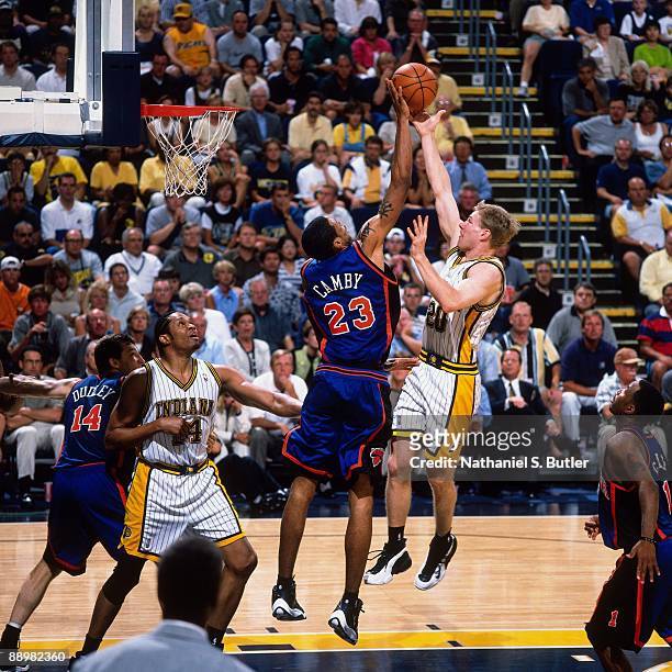 Fred Hoiberg of the Indiana Pacers has his shot rejected by Marcus Camby of the New York Knicks in Game Five of the Eastern Conference Finals during...