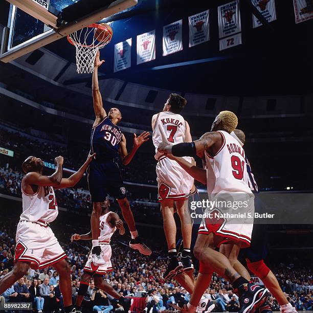 Kerry Kittles of the New Jersey Nets shoots a layup against Toni Kukoc of the Chicago Bulls in Game One of the Eastern Conference Quarterfinals...