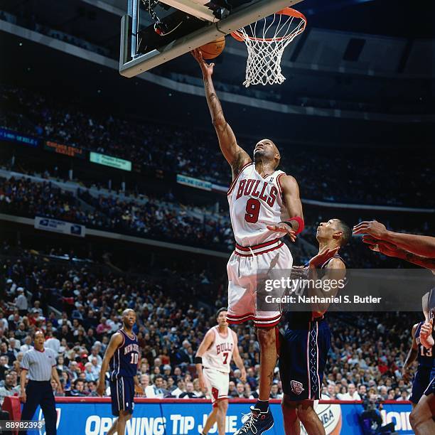 Ron Harper of the Chicago Bulls shoots a layup against Kerry Kittles of the New Jersey Nets in Game One of the Eastern Conference Quarterfinals...