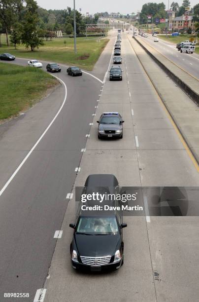 The motorcade transporting former NFL quarterback Steve McNair travels up Highway 49 following a funeral service on the campus of University of...