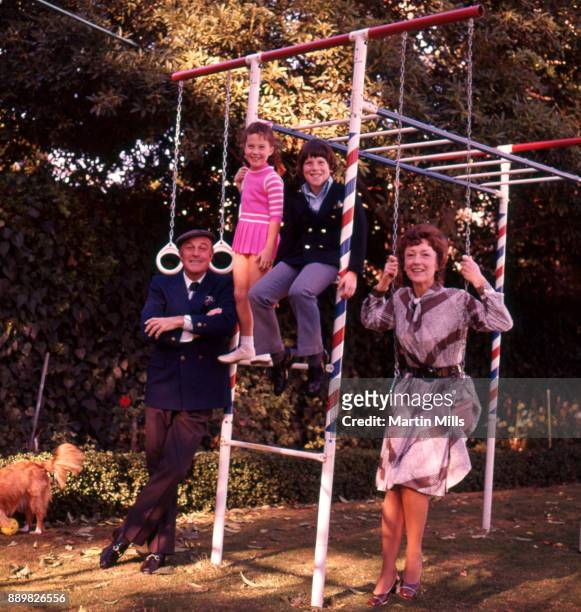 Actor Gene Kelly with his wife Jeanne Coyne, son Tim and daughter Bridget, pose for a family portrait in 1971 in Los Angeles, California.
