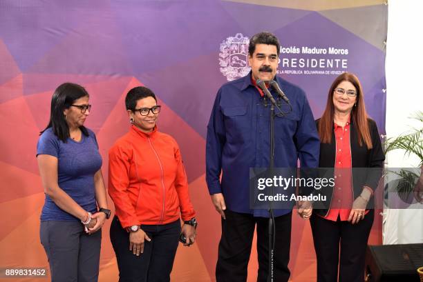 President of Venezuela, Nicolas Maduro makes a speech during a press conference as he is flanked by his wife First Lady Cilia Flores , Venezuela's...