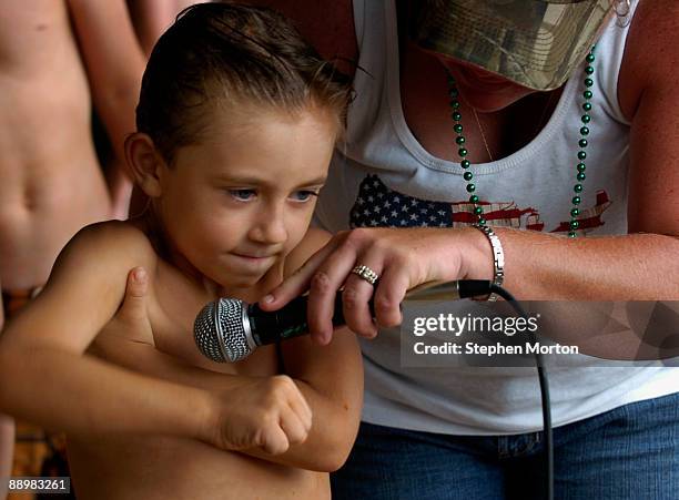 Arm pit serenade winner Aubrey Matthews performs his best song during the 13th Annual Summer Redneck Games July 11, 2009 in East Dublin, Georgia....