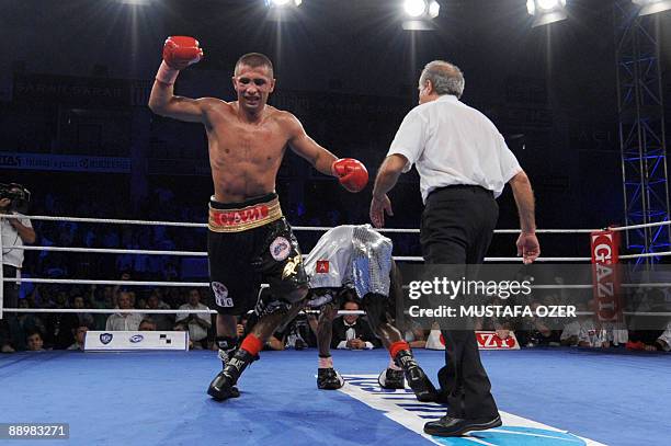 Selcuk Aydin of Turkey celebrates after winning the European Title boxing fight against Belgian Sugar Jackson Osei Bonsu on July 11, 2009 in...