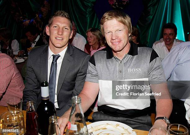 Bastian Schweinsteiger and Oliver Kahn attend a party after 'Kaiser Cup 2009' golf tournament at the Hartl Resort Event Hall on July 11, 2009 in Bad...