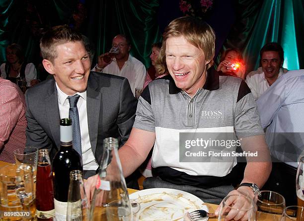 Bastian Schweinsteiger and Oliver Kahn attend a party after 'Kaiser Cup 2009' golf tournament at the Hartl Resort Event Hall on July 11, 2009 in Bad...