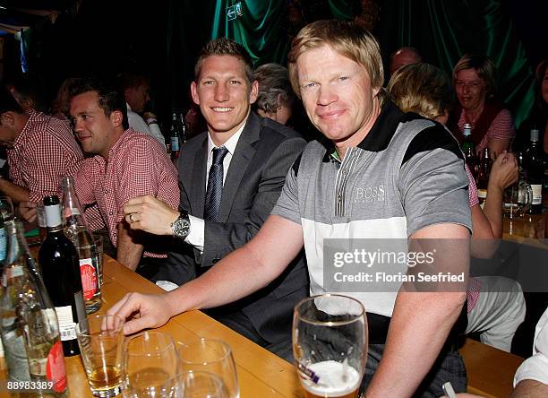 Bastian Schweinsteiger and Oliver Kahn attend a party after 'Kaiser Cup 2009' golf tournament at the Hartl Resort Event Hall on July 11, 2009 in Bad...