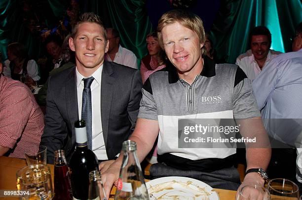 Bastian Schweinsteiger and Oliver Kahn attend a party after 'Kaiser Cup 2009' golf tournament at the Hartl Resort Event Hall on July 11, 2009 in Bad...