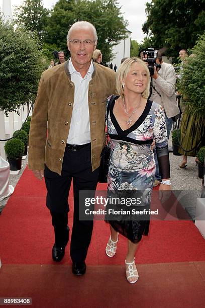 Franz Beckenbauer and wife Heidi attend a party after 'Kaiser Cup 2009' golf tournament at the Hartl Resort Event Hall on July 11, 2009 in Bad...