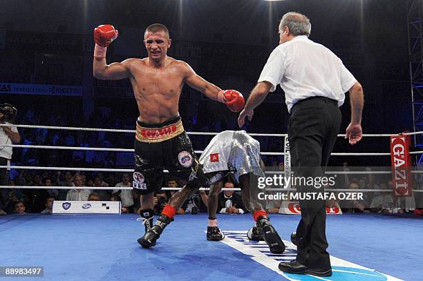 Selcuk Aydin of Turkey celebrates after winning the European Title boxing fight against Belgian Sugar Jackson Osei Bonsu on July 11, 2009 in...