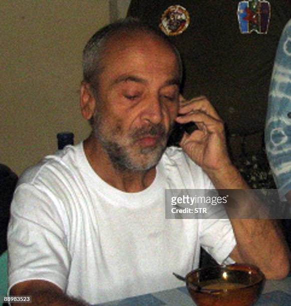 Freed Italian hostage Eugenio Vagni talks over the phone at a hospital in Jolo early July 12, 2009. Freed Italian hostage Eugenio Vagni was in...