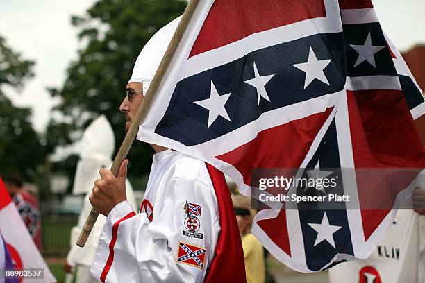 Members of the Fraternal White Knights of the Ku Klux Klan participate in the 11th Annual Nathan Bedford Forrest Birthday march July 11, 2009 in...